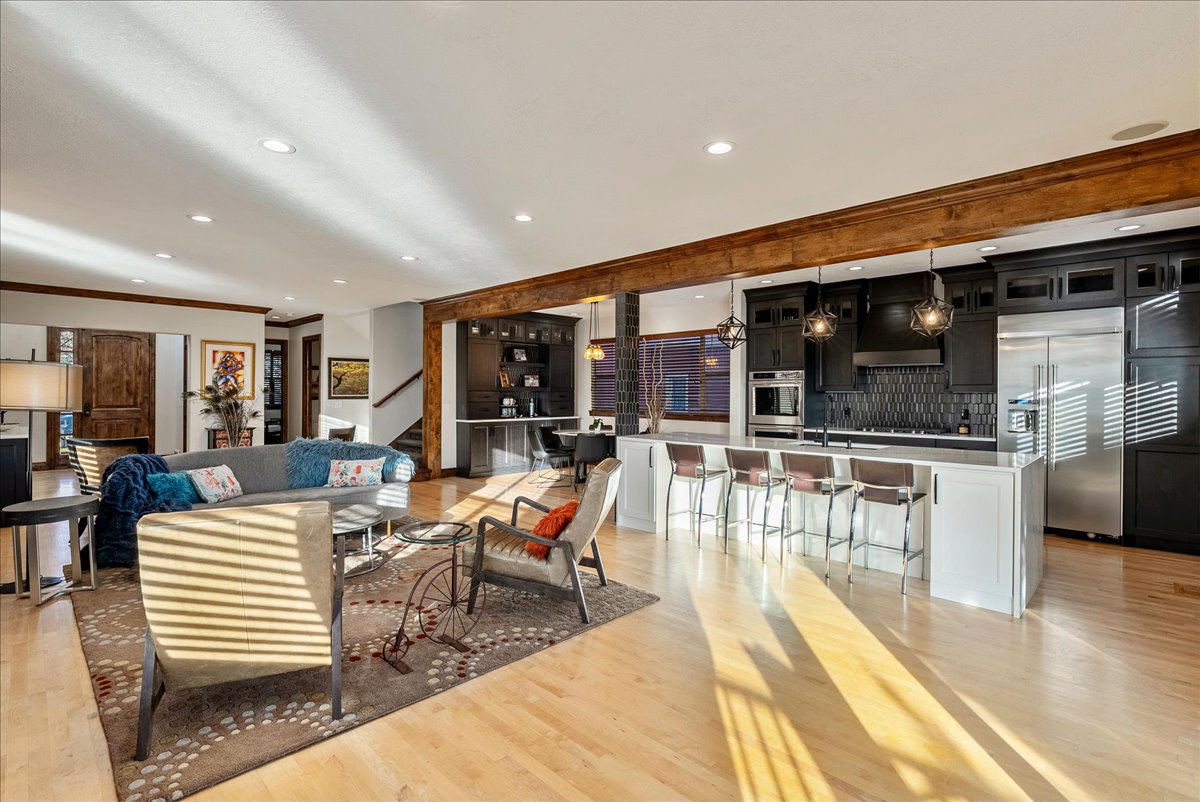 Sightline to the gourmet kitchen anchored by a generous island