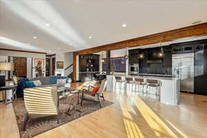 Sightline to the gourmet kitchen anchored by a generous island