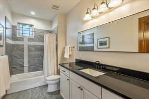 Upstairs full bathroom featuring tasteful finishes, a spacious layout, and comfort-designed functionality for family or guests.