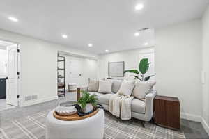 Large downstairs living room featuring a built-in entertainment wall.