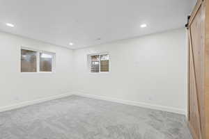 Primary bedroom downstairs with barn door into huge walk-in closet