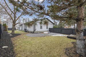Spacious backyard, xeroscaped fire pit, garden box, mature trees and mountain views.