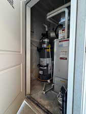 Utilities featuring water heater and heating unit