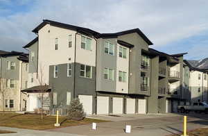 View of apartment building / complex with an attached garage