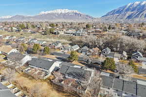 Aerial view of residential area featuring a mountainous background