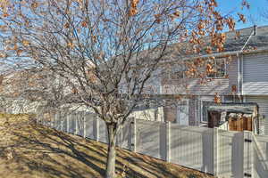 View of home's exterior with roof with shingles
