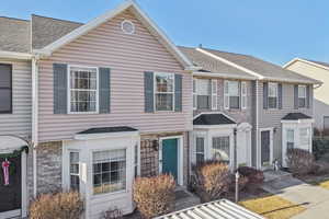 View of front facade featuring a shingled roof
