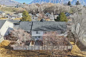 Aerial perspective of suburban area featuring a mountain backdrop