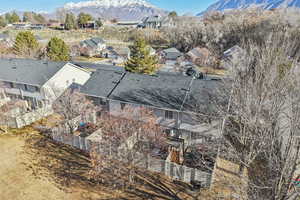 Aerial perspective of suburban area with a mountain backdrop