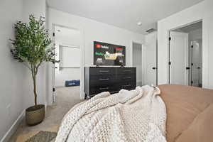 Bedroom with baseboards and carpet flooring