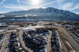 Aerial view of residential area featuring a mountainous background