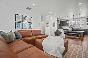 Living area with recessed lighting and wood finished floors