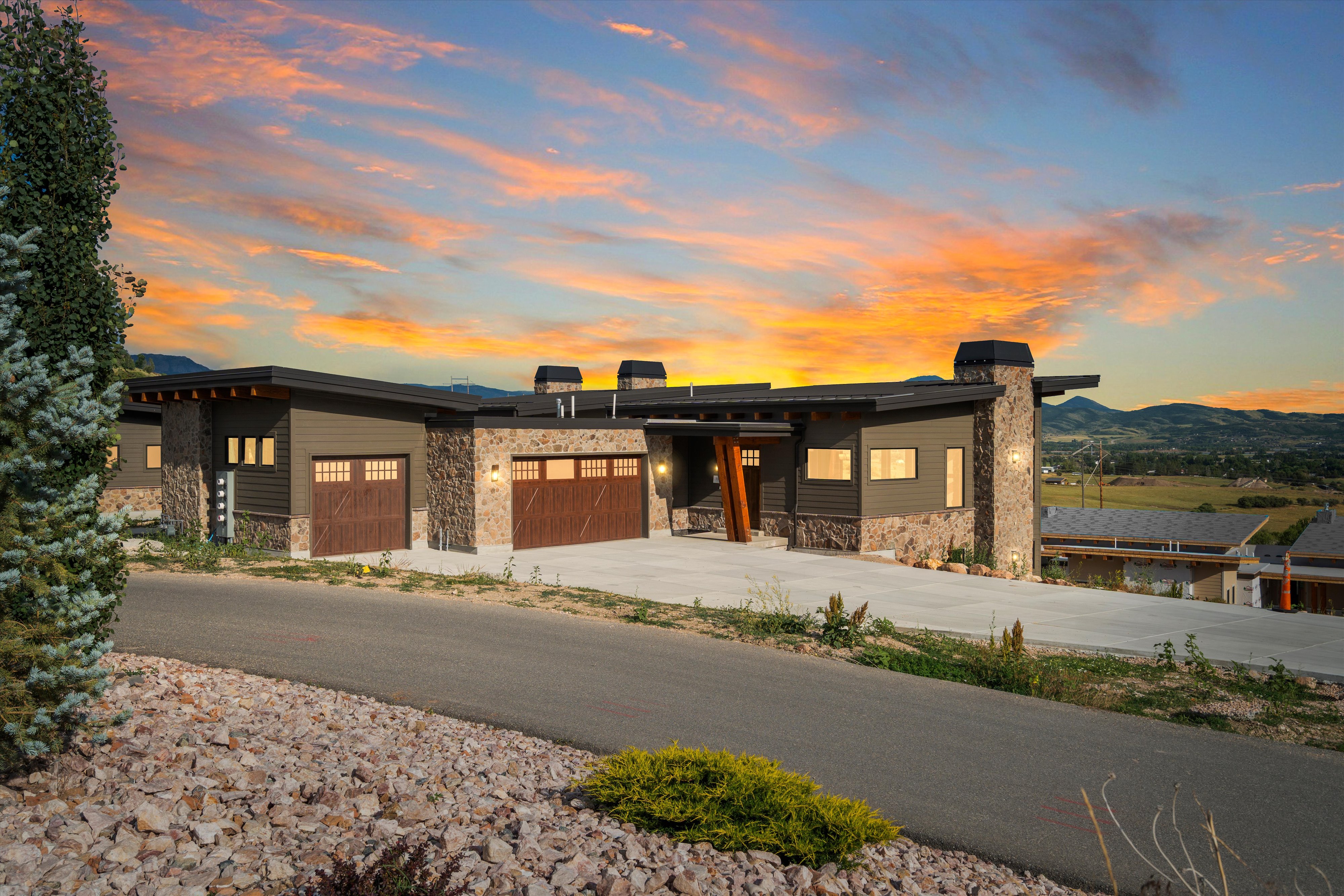 Modern architectural design featuring stone and horizontal siding