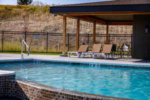 View of swimming pool with a patio area