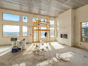 Unfurnished living room with a glass covered fireplace