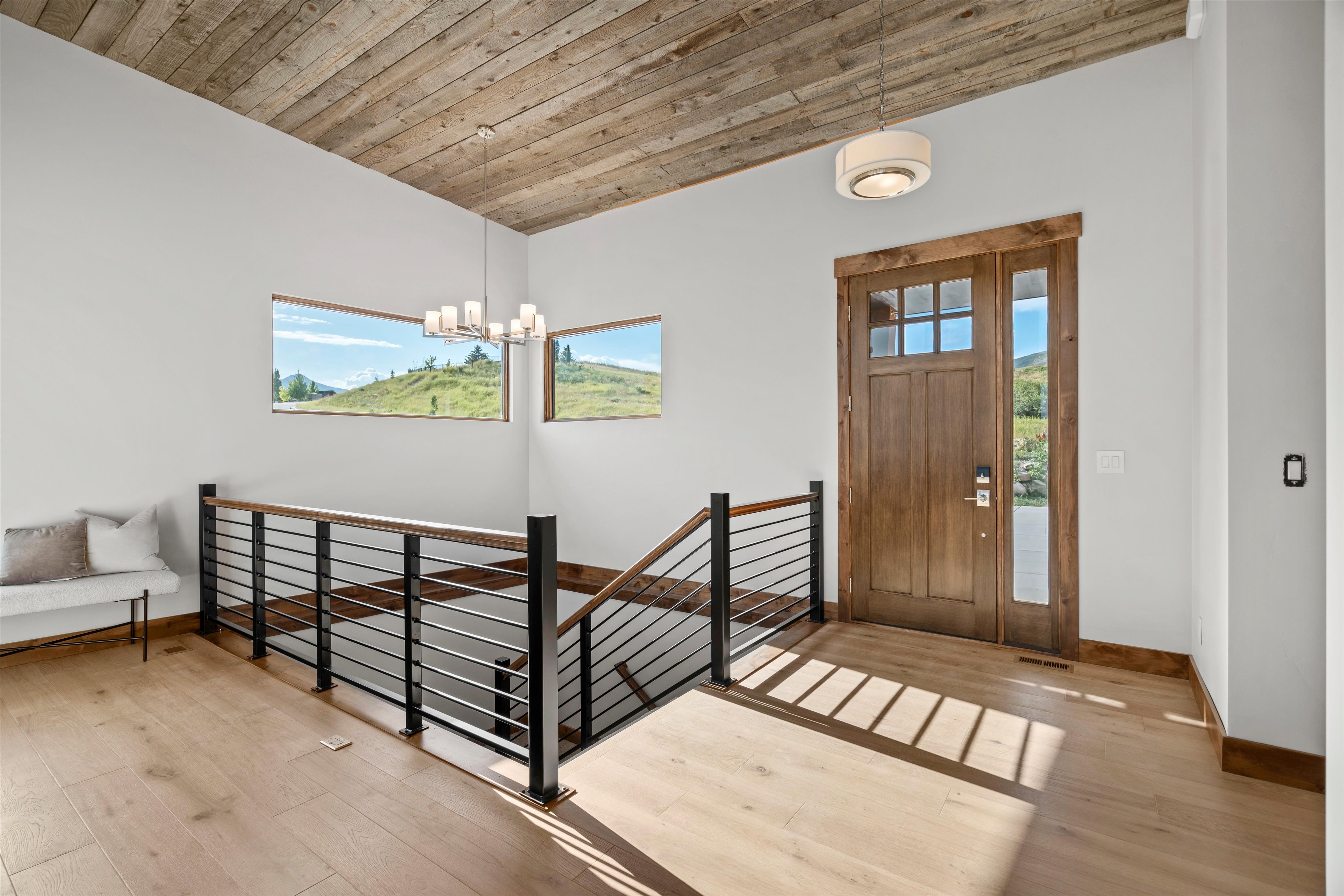 Warm wood-finish flooring complements a distinctive wood plank ceiling