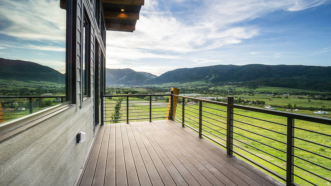 Wooden deck featuring a mountain view