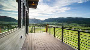 Wooden deck featuring a mountain view