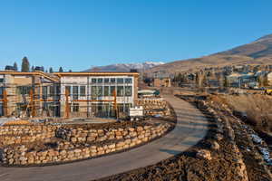 Rear view of house featuring a mountain view
