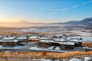 View of mountain background featuring nearby suburban area