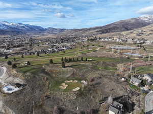 View of property location featuring nearby suburban area and a water and mountain view