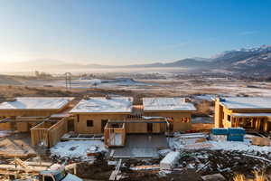 View of front of property featuring a mountain view and a patio