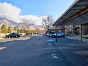 Partially covered parking lot with a mountain view