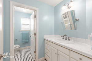 Bathroom featuring vanity and light tile patterned flooring
