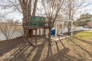 View of jungle gym featuring a fenced backyard