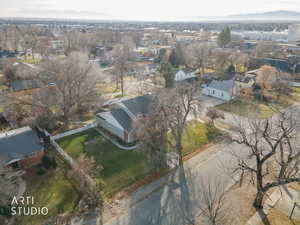 Aerial view of property's location with nearby suburban area and mountains