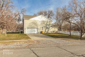 View of front of house featuring driveway and a garage