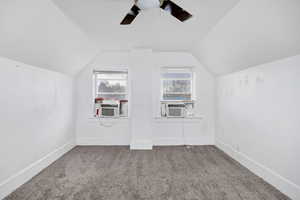 Bonus room featuring carpet flooring and a ceiling fan