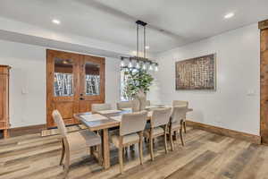 Dining space featuring light wood-style flooring and recessed lighting