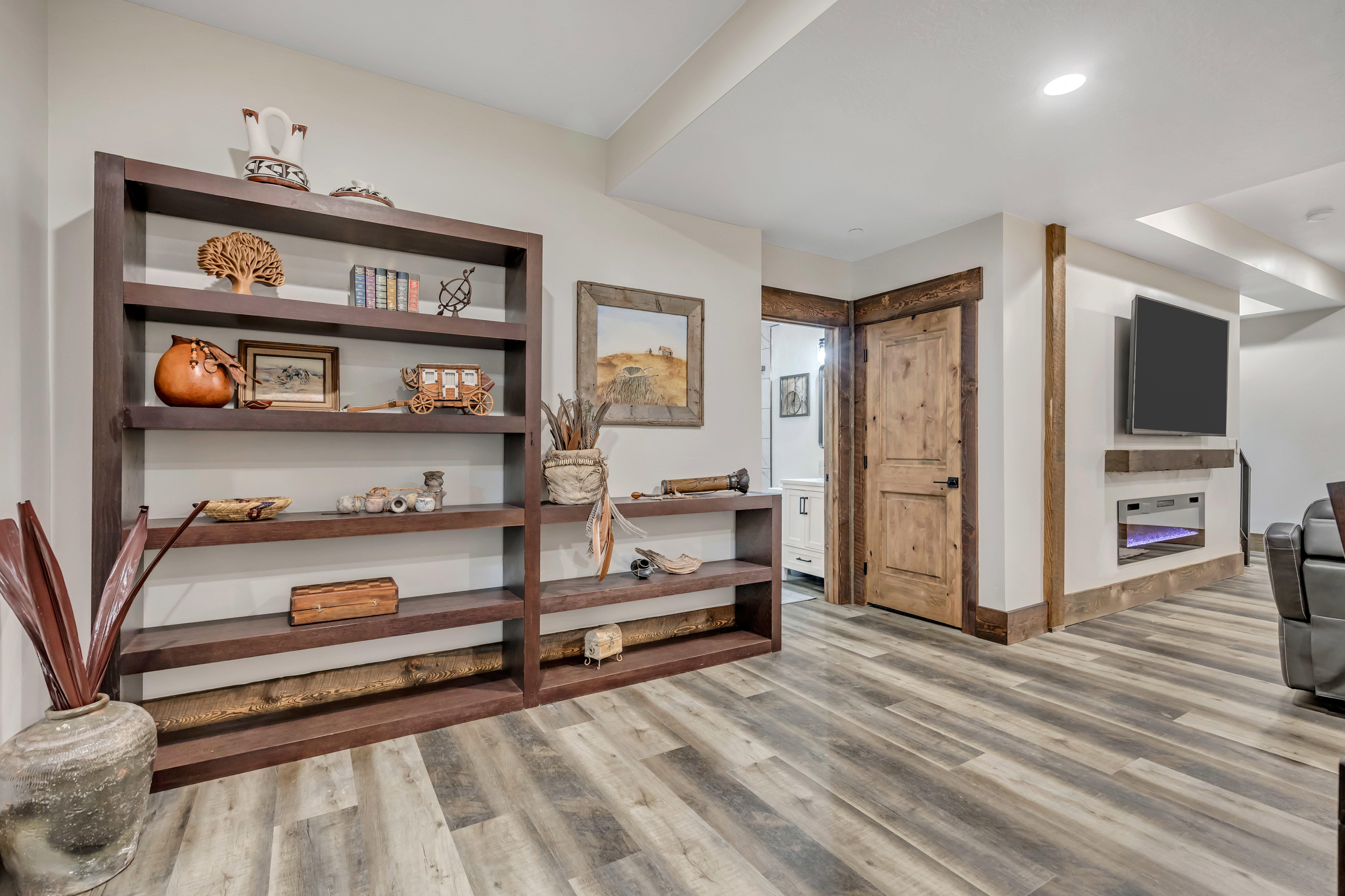 Hall with light wood finished floors and baseboards