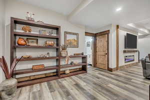 Hall with light wood finished floors and baseboards