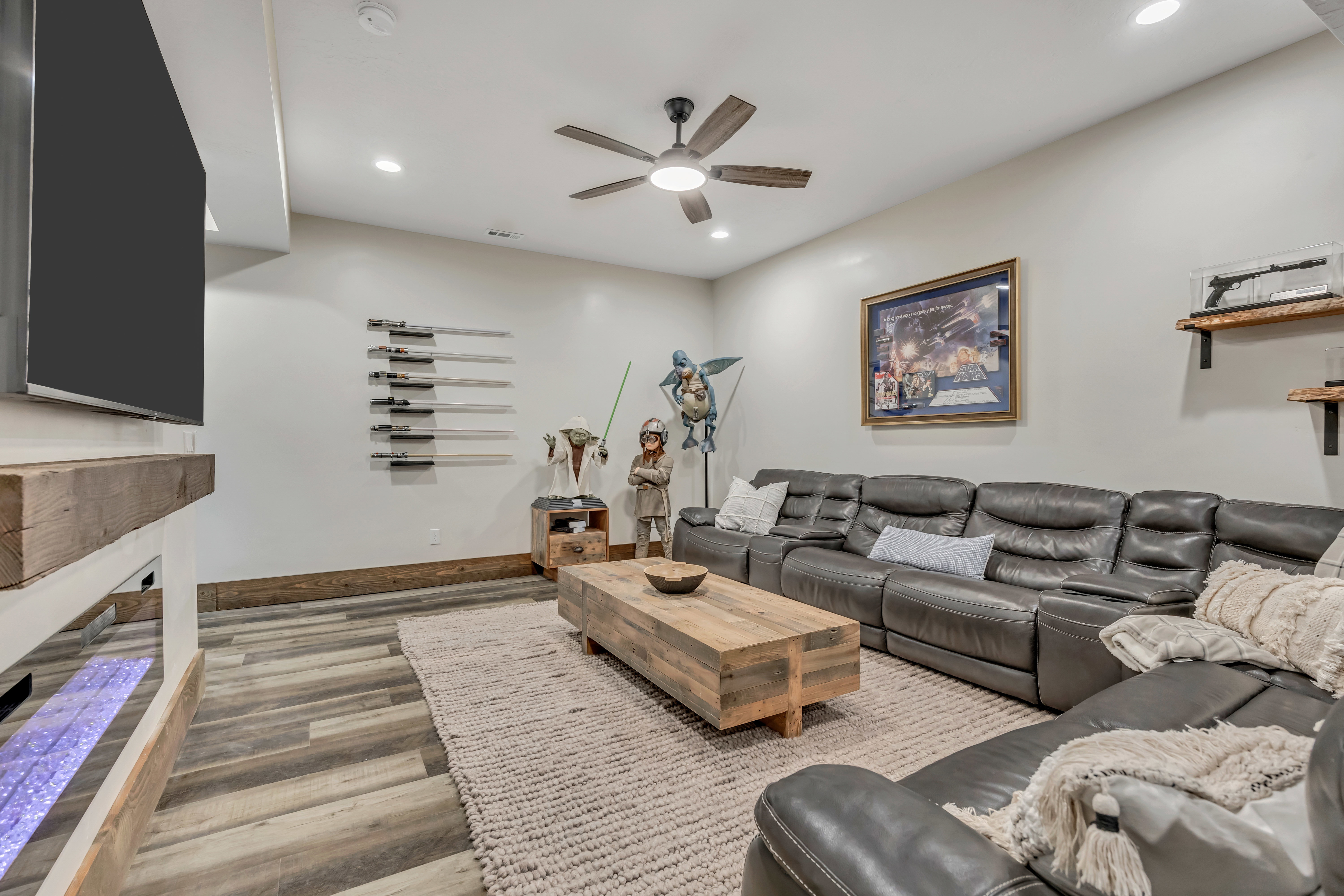 Living room featuring light wood-style floors, ceiling fan, and recessed lighting