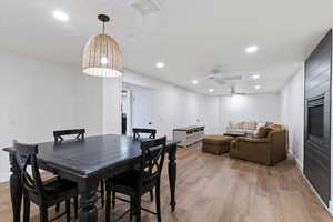 Dining space with light wood finished floors, recessed lighting, and a ceiling fan