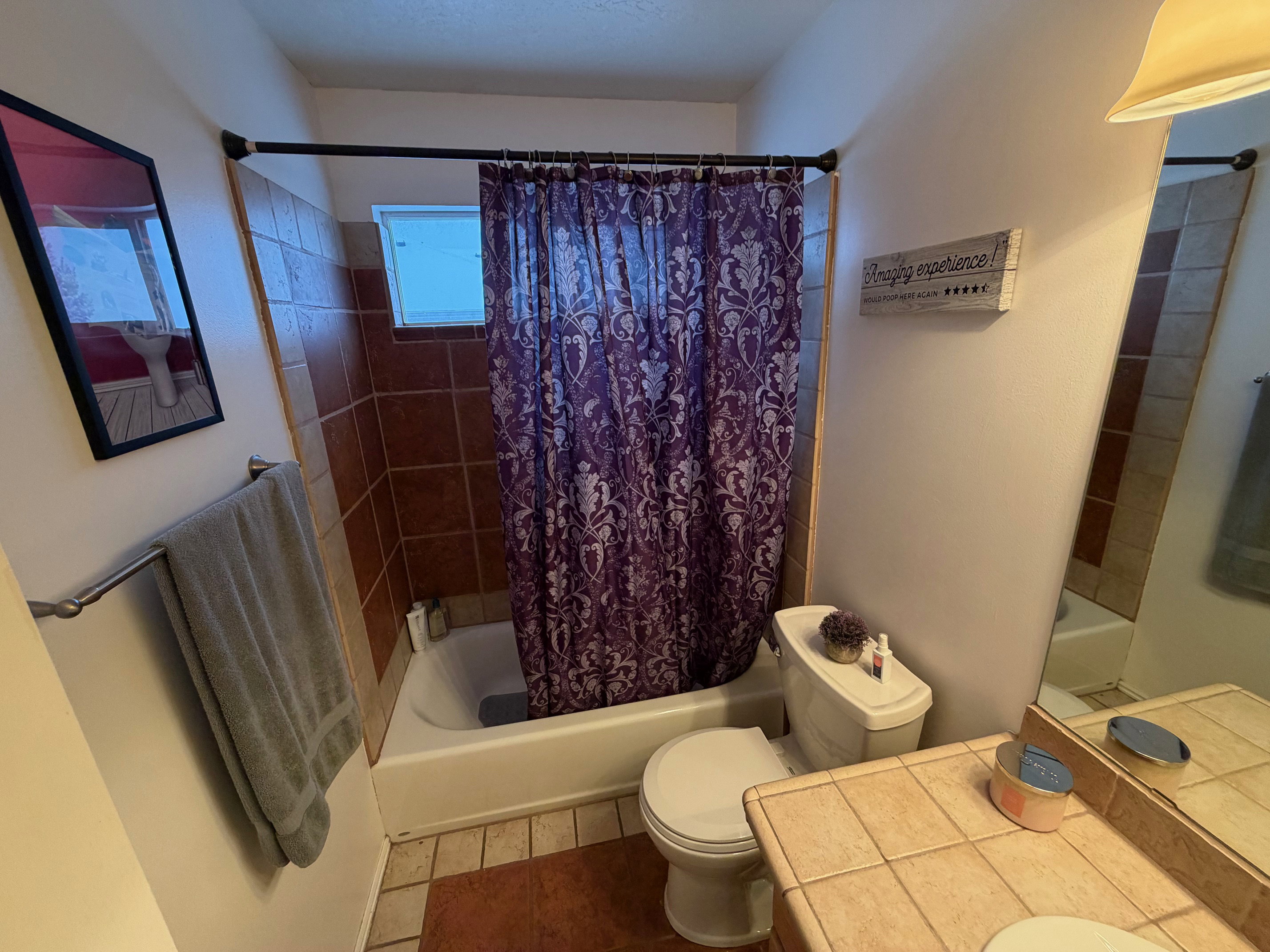 Bathroom with shower / tub combo with curtain, vanity, and tile patterned floors