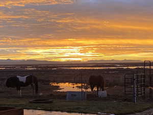 Water view featuring a mountainous background and rural landscape