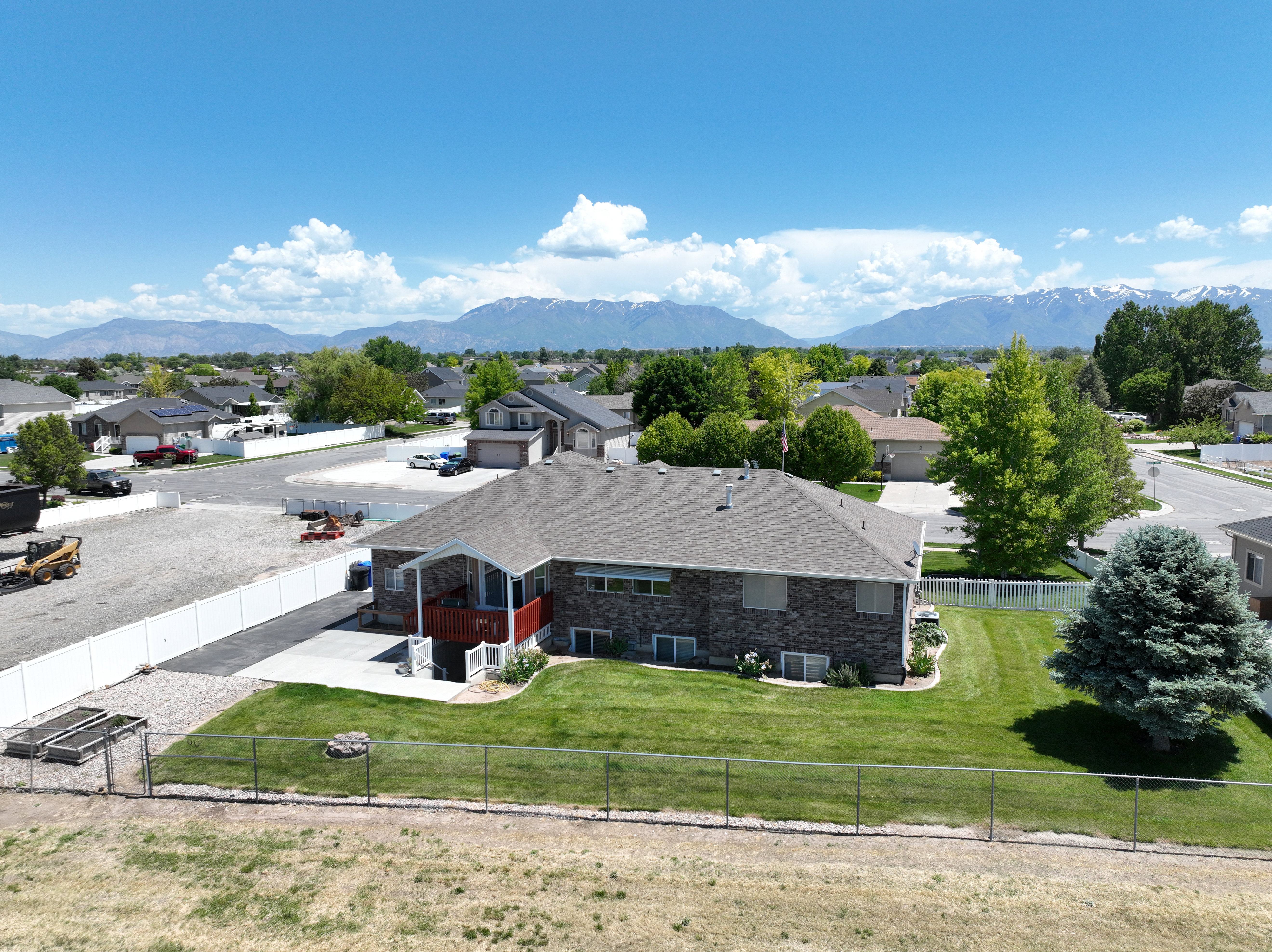 Aerial view of residential area featuring mountains