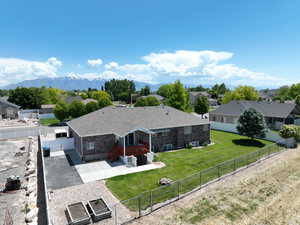 Aerial perspective of suburban area featuring a mountainous background