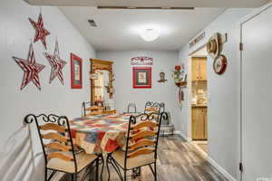 Dining room featuring light wood finished floors and baseboards