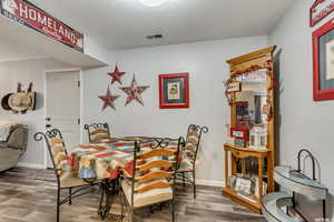 Dining area with wood finished floors and baseboards
