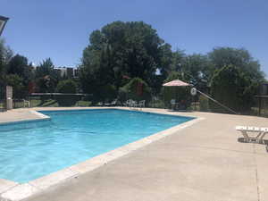Community pool featuring a patio area