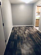 Unfurnished room with dark wood finished floors