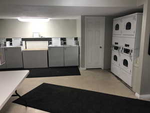 Community laundry with washer and clothes dryer and stacked washer and clothes dryer