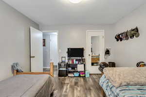 Bedroom featuring wood finished floors