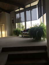 Sunroom / solarium with beam ceiling