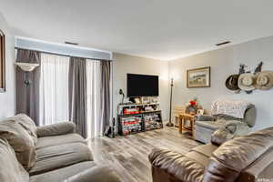 Living area featuring light wood finished floors