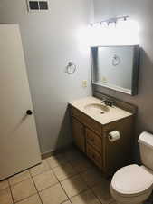 Bathroom featuring vanity and light tile patterned flooring